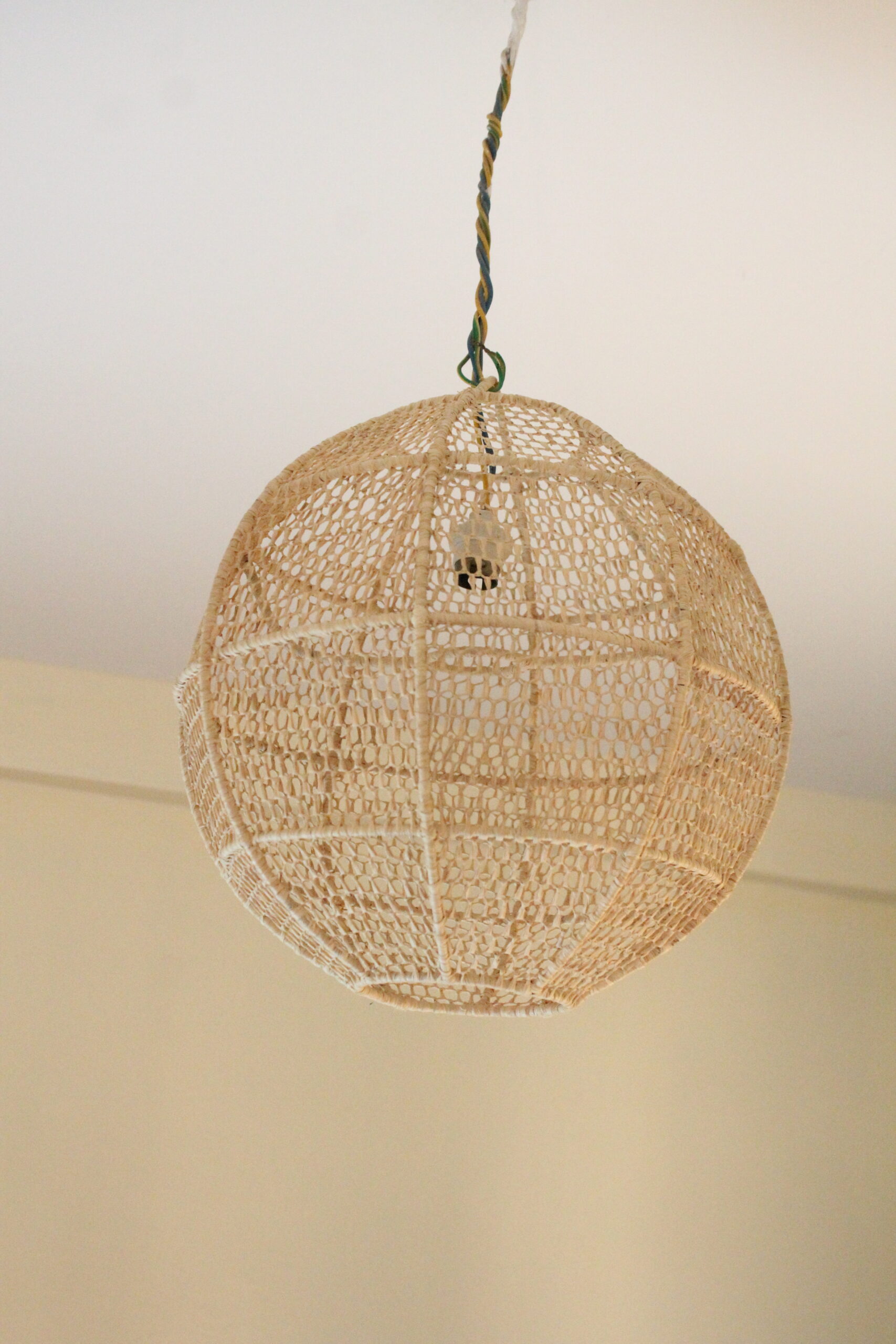 Hand-crafted hanging lamp in raffia